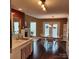 Cozy dining area featuring hardwood floors, a chandelier, and natural light from the doors to the deck at 1640 Winthrop Ln, Monroe, NC 28110