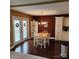 Eat-in dining space with hardwood floors, chandelier, and natural light from the double french doors at 1640 Winthrop Ln, Monroe, NC 28110