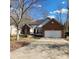 Inviting single-story brick home featuring a well-maintained front yard and an attached two-car garage at 1640 Winthrop Ln, Monroe, NC 28110