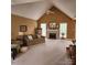 Spacious living room with high ceilings, a fireplace, and a neutral color palette at 1640 Winthrop Ln, Monroe, NC 28110