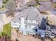 Aerial view showcasing the backyard deck, patio, and landscaping of the home at 17201 Royal Court Dr, Davidson, NC 28036