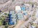 Aerial view of the community tennis center, featuring multiple courts and a clubhouse at 17201 Royal Court Dr, Davidson, NC 28036