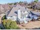 Aerial view of the deck, patio area, and landscaped backyard at 17201 Royal Court Dr, Davidson, NC 28036