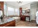 Bathroom features a jetted tub, granite countertops, custom cabinetry and tiled floor at 17201 Royal Court Dr, Davidson, NC 28036