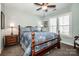 Cozy bedroom features a ceiling fan, large windows and warm color palette at 17201 Royal Court Dr, Davidson, NC 28036