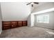 Spacious bedroom featuring a vaulted ceiling, built-in shelving, and natural light at 17201 Royal Court Dr, Davidson, NC 28036