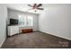 Cozy bedroom featuring a ceiling fan, natural light, and neutral tones at 17201 Royal Court Dr, Davidson, NC 28036