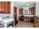 Large laundry room with granite counters, lots of cabinet space and shelving at 17201 Royal Court Dr, Davidson, NC 28036