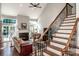 Elegant living room with fireplace, large windows, and hardwood floors at 17201 Royal Court Dr, Davidson, NC 28036