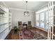 Bright living room with custom built-ins, plantation shutters, and hardwood floors at 17201 Royal Court Dr, Davidson, NC 28036