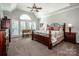 Spacious main bedroom boasts vaulted ceiling, large window, and a sitting area at 17201 Royal Court Dr, Davidson, NC 28036