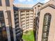 Aerial view of a brick condo building surrounding a courtyard with grass and a sitting area at 211 Heritage Blvd # 612, Fort Mill, SC 29715