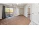 Bedroom featuring a sliding glass door to a balcony, neutral walls, and carpet flooring at 211 Heritage Blvd # 612, Fort Mill, SC 29715