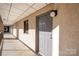 Hallway leading to unit 612, featuring neutral decor and a small window at 211 Heritage Blvd # 612, Fort Mill, SC 29715