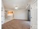 Living room with carpet flooring, neutral walls, a view to the kitchen, and doors to other rooms at 211 Heritage Blvd # 612, Fort Mill, SC 29715