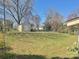 Spacious backyard featuring a storage shed and lush green grass at 2210 Milton Rd, Charlotte, NC 28215