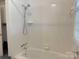 Full bathroom featuring a shower/tub combo with white tile and modern fixtures at 2210 Milton Rd, Charlotte, NC 28215