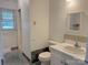 Bathroom features a sink, toilet, and window with lots of natural light at 2210 Milton Rd, Charlotte, NC 28215