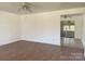 Open living area with tile flooring, a ceiling fan, and a view into an adjacent room at 2210 Milton Rd, Charlotte, NC 28215