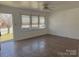 Inviting living room with tile flooring, natural light, and neutral color scheme at 2210 Milton Rd, Charlotte, NC 28215