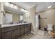 Bathroom featuring a double sink granite countertop, dark cabinets, and neutral color scheme at 2375 Ellison Cir, Lancaster, SC 29720