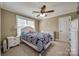 Bedroom featuring a ceiling fan, large window with blinds, and neutral-toned walls at 2375 Ellison Cir, Lancaster, SC 29720