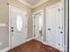 Bright foyer with an oval glass front door and wood-look flooring at 2375 Ellison Cir, Lancaster, SC 29720