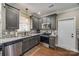 Modern kitchen featuring gray cabinets, stainless steel appliances, and a stylish backsplash at 2375 Ellison Cir, Lancaster, SC 29720