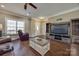 Inviting living room with wood-look floors, a cozy recliner, and a large entertainment center at 2375 Ellison Cir, Lancaster, SC 29720