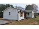 A newly renovated home with crisp white siding and light wood shuttered windows at 2400 Pressley Rd, Chester, SC 29712