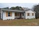 Charming single-story home with white siding, black trim, and wooden shutters at 2400 Pressley Rd, Chester, SC 29712