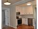 Modern kitchen featuring stainless steel appliances, new granite countertops, and white cabinetry at 2400 Pressley Rd, Chester, SC 29712