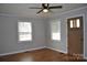 Bright living room with hardwood floors, ceiling fan and large windows at 2400 Pressley Rd, Chester, SC 29712