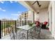 Spacious balcony featuring outdoor seating, iron railings, and scenic building view at 2823 Providence Rd # 156, Charlotte, NC 28211