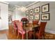 Elegant dining room with chandelier, wood table, and stylish wall art at 2823 Providence Rd # 156, Charlotte, NC 28211