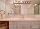 A bathroom with vanity, and mirror and a pink marble countertop at 303 Wade St, Wadesboro, NC 28170