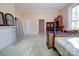 Bedroom featuring carpet, large window, and neutral paint, providing ample natural light at 303 Wade St, Wadesboro, NC 28170