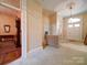 Home entryway featuring a vintage radiator and detailed trimwork at 303 Wade St, Wadesboro, NC 28170