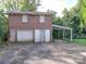 Brick two-story detached garage with multiple bays and covered parking at 303 Wade St, Wadesboro, NC 28170