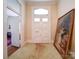 Hallway featuring double doors and a large framed painting on the floor at 303 Wade St, Wadesboro, NC 28170