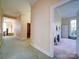 Hallway leading to a bedroom, showcasing a fireplace with mantel and neutral paint, adding to the home's charm at 303 Wade St, Wadesboro, NC 28170