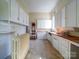 Kitchen featuring white cabinets and retro wood countertops at 303 Wade St, Wadesboro, NC 28170