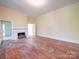 Spacious living room with hardwood floors, fireplace, and natural light at 303 Wade St, Wadesboro, NC 28170