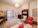 Living room with a floral rug, chandelier, fireplace, and neutral walls at 303 Wade St, Wadesboro, NC 28170