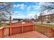 This home has a spacious back deck perfect for relaxing with its wood floor and matching orange painted railings at 315 E Washington Ave, Bessemer City, NC 28016