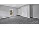 Bedroom featuring gray carpeted flooring, one window and a closet at 315 E Washington Ave, Bessemer City, NC 28016