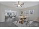 Spacious dining room adjacent to the living area with a modern table and light gray walls at 315 E Washington Ave, Bessemer City, NC 28016