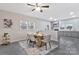 Stylish dining room featuring a modern table, gray wood floors, and an adjacent kitchen at 315 E Washington Ave, Bessemer City, NC 28016