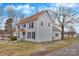 Inviting two-story home showcasing its light gray exterior, brown roof, and spacious yard at 315 E Washington Ave, Bessemer City, NC 28016