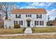 Charming two-story home with light gray siding, black shutters, and a well-maintained front yard at 315 E Washington Ave, Bessemer City, NC 28016